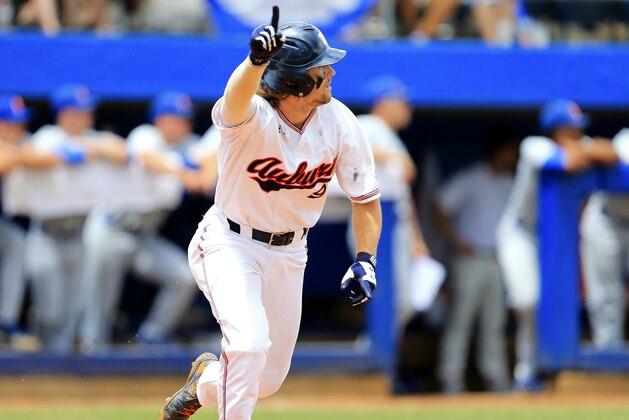 Auburn batter Luke Jarvis celebrates after hitting a walk off single against Florida during the ninth inning of an NCAA Super Regional college baseball game Sunday, June 10, 2018, in Gainesville, Fla. (AP Photo/Matt Stamey)