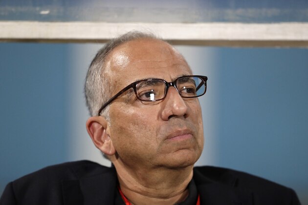 Carlos Cordeiro, vice president of U.S. soccer, watches warmups from the team bench ahead of the start of the U.S.'s final World Cup qualifying match against Trinidad and Tobago at Ato Boldon Stadium in Couva, Trinidad, Tuesday, Oct. 10, 2017. (AP Photo/Rebecca Blackwell)