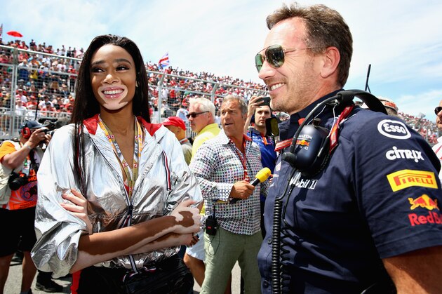 MONTREAL, QC - JUNE 10: Red Bull Racing Team Principal Christian Horner talks with supermodel Winnie Harlow on the grid before the Canadian Formula One Grand Prix at Circuit Gilles Villeneuve on June 10, 2018 in Montreal, Canada.  (Photo by Mark Thompson/Getty Images)
