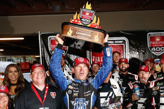 BROOKLYN, MI - JUNE 10:  Clint Bowyer, driver of the #14 Haas 30 Years of the VF1 Ford, celebrates with the trophy after winning the Monster Energy NASCAR Cup Series FireKeepers Casino 400 at Michigan International Speedway on June 10, 2018 in Brooklyn, Michigan.  (Photo by Jeff Zelevansky/Getty Images)