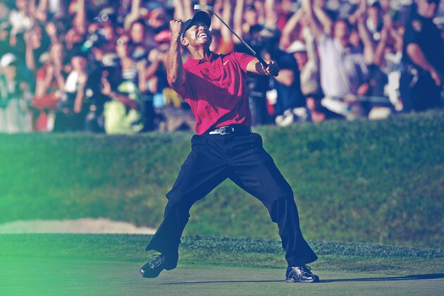 FILE - This is a June 16, 2008, file photo showing Tiger Woods kissing the championship trophy after winning the US Open,  against Rocco Mediate, left, after a sudden death hole following an 18-hole playoff round at Torrey Pines Golf Course,  in San Diego.