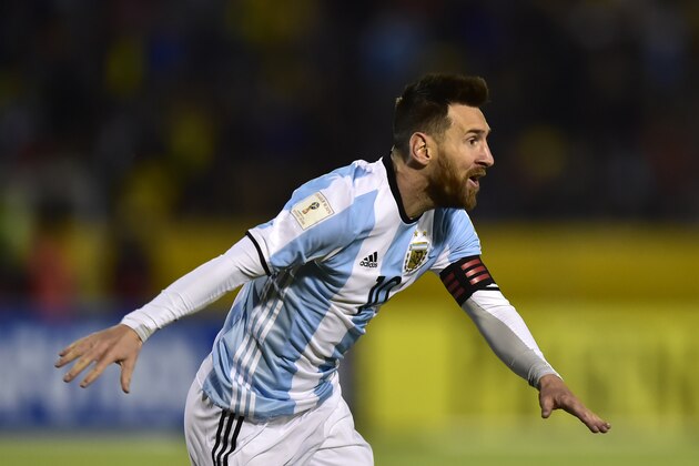 Argentina's Lionel Messi celebrates after scoring his third goal against Ecuador during their 2018 World Cup qualifier football match in Quito, on October 10, 2017. / AFP PHOTO / Rodrigo BUENDIA        (Photo credit should read RODRIGO BUENDIA/AFP/Getty Images)