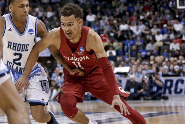 Oklahoma's Trae Young drives to the hoop during overtime of an NCAA men's college basketball tournament first-round game against Rhode Island, Thursday, March 15, 2018, in Pittsburgh. (AP Photo/Keith Srakocic)
