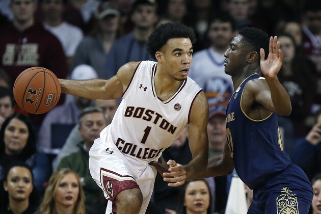 Boston College's Jerome Robinson (1) drives past Notre Dame's TJ Gibbs during the second half of an NCAA college basketball game in Boston, Saturday, Feb. 17, 2018. Notre Dame won 84-67. (AP Photo/Michael Dwyer)