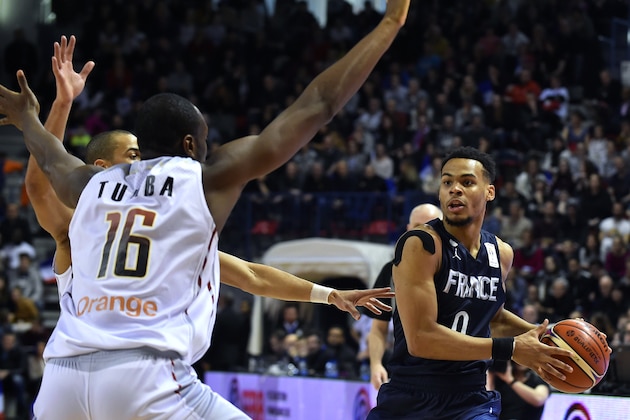 France's Elie Okobo (R) is challenged by  Belgium's  Kevin Tumba during the FIBA Basketball World Cup 2019 qualifying match between France and Belgium at the Palais des Sports Jean Weille in Nancy, eastern France, on February 25, 2018. / AFP PHOTO / JEAN-CHRISTOPHE VERHAEGEN        (Photo credit should read JEAN-CHRISTOPHE VERHAEGEN/AFP/Getty Images)