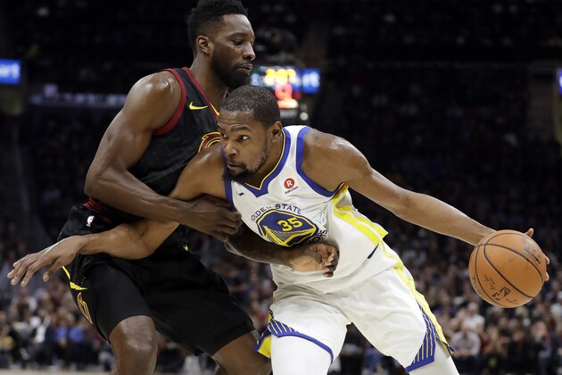 Cleveland Cavaliers forward Jeff Green defends against Golden State Warriors' Kevin Durant during the first half of Game 4 of basketball's NBA Finals, Friday, June 8, 2018, in Cleveland. (AP Photo/Tony Dejak)