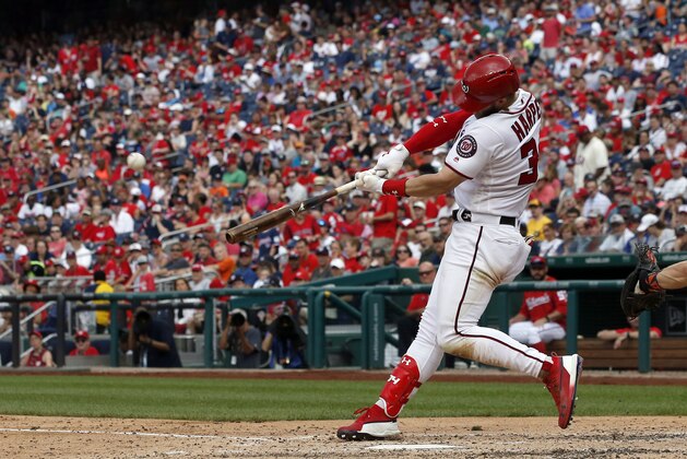 Washington Nationals' Bryce Harper hits a solo home run during the fourth inning of a baseball game against the San Francisco Giants at Nationals Park, Saturday, June 9, 2018, in Washington. (AP Photo/Alex Brandon)