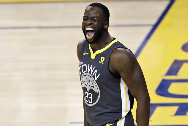 Golden State Warriors forward Draymond Green (23) celebrates after scoring against the Cleveland Cavaliers during the first half of Game 2 of basketball's NBA Finals in Oakland, Calif., Sunday, June 3, 2018. (AP Photo/Marcio Jose Sanchez)