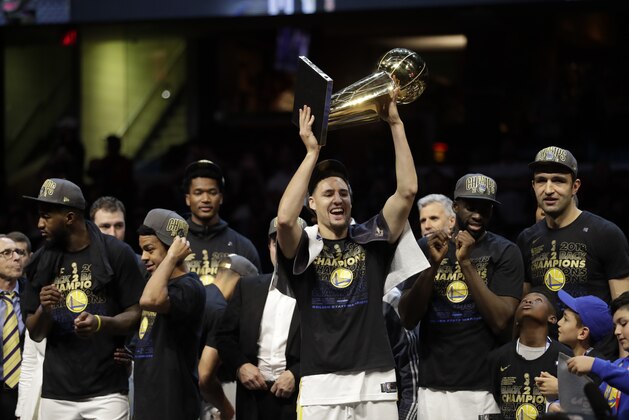 Golden State Warriors' Klay Thompson celebrates after the Warriors defeated the Cleveland Cavaliers 108-85 in Game 4 of basketball's NBA Finals to win the NBA championship, Friday, June 8, 2018, in Cleveland. (AP Photo/Tony Dejak)