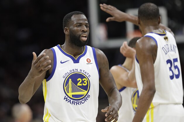 Golden State Warriors' Draymond Green and Kevin Durant celebrate during the second half of Game 4 of basketball's NBA Finals against the Golden State Warriors, Friday, June 8, 2018, in Cleveland. (AP Photo/Tony Dejak)