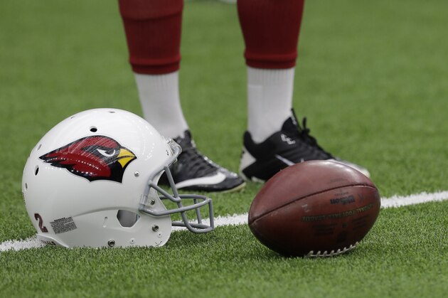 A Arizona Cardinals helmet rests on the field before an NFL football game against the Houston Texans, Sunday, Nov. 19, 2017, in Houston. (AP Photo/David J. Phillip)