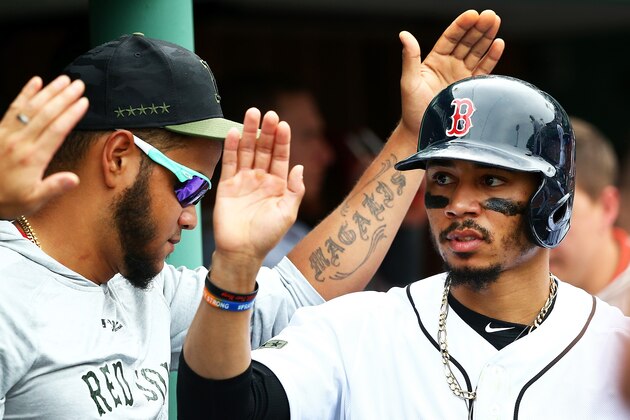 BOSTON, MA - MAY 26: Mookie Betts #50 of the Boston Red Sox returns to the dugout after scoring in the sixth inning of a game against the Atlanta Braves at Fenway Park on May 26, 2018 in Boston, Massachusetts.  (Photo by Adam Glanzman/Getty Images)
