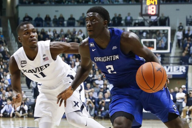 Creighton's Khyri Thomas (2) drives against Xavier's Malcolm Bernard (11) in the second half of an NCAA college basketball game, Monday, Jan. 16, 2017, in Cincinnati. Creighton won 72-67. (AP Photo/John Minchillo)