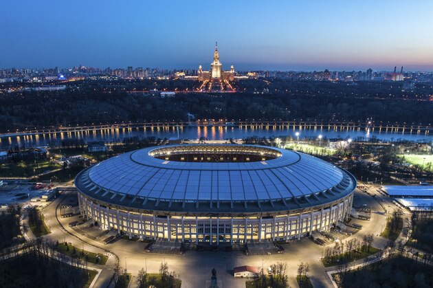 This photo taken on Monday, April 23, 2018, shows an aerial view of the World Cup Luzhniki stadium with the Moscow River and the State University in the background in Moscow, Russia. The Luzhniki stadium will hold the 2018 World Cup final. (AP Photo/Dmitry Serebryakov)