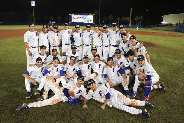 Florida celebrates with a group photo after they defeated Auburn in an NCAA Super Regional college baseball game Monday, June 11, 2018, in Gainesville, Fla. (AP Photo/Matt Stamey)