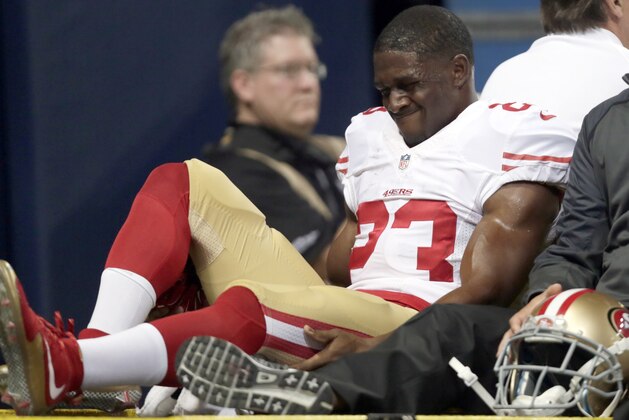 San Francisco 49ers running back Reggie Bush is taken off on a cart during the first quarter of an NFL football game against the St. Louis Rams Sunday, Nov. 1, 2015, in St. Louis. (AP Photo/Tom Gannam)