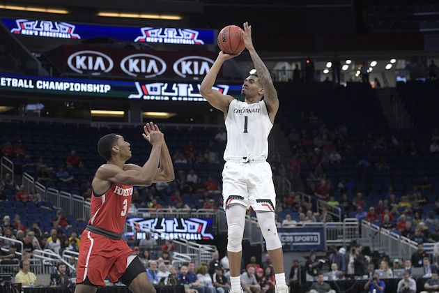 Cincinnati guard Jacob Evans (1) goes up for a shot in front of Houston guard Armoni Brooks (3) during the first half of an NCAA college basketball championship game at the American Athletic Conference tournament Sunday, March 11, 2018, in Orlando, Fla. (AP Photo/Phelan M. Ebenhack)
