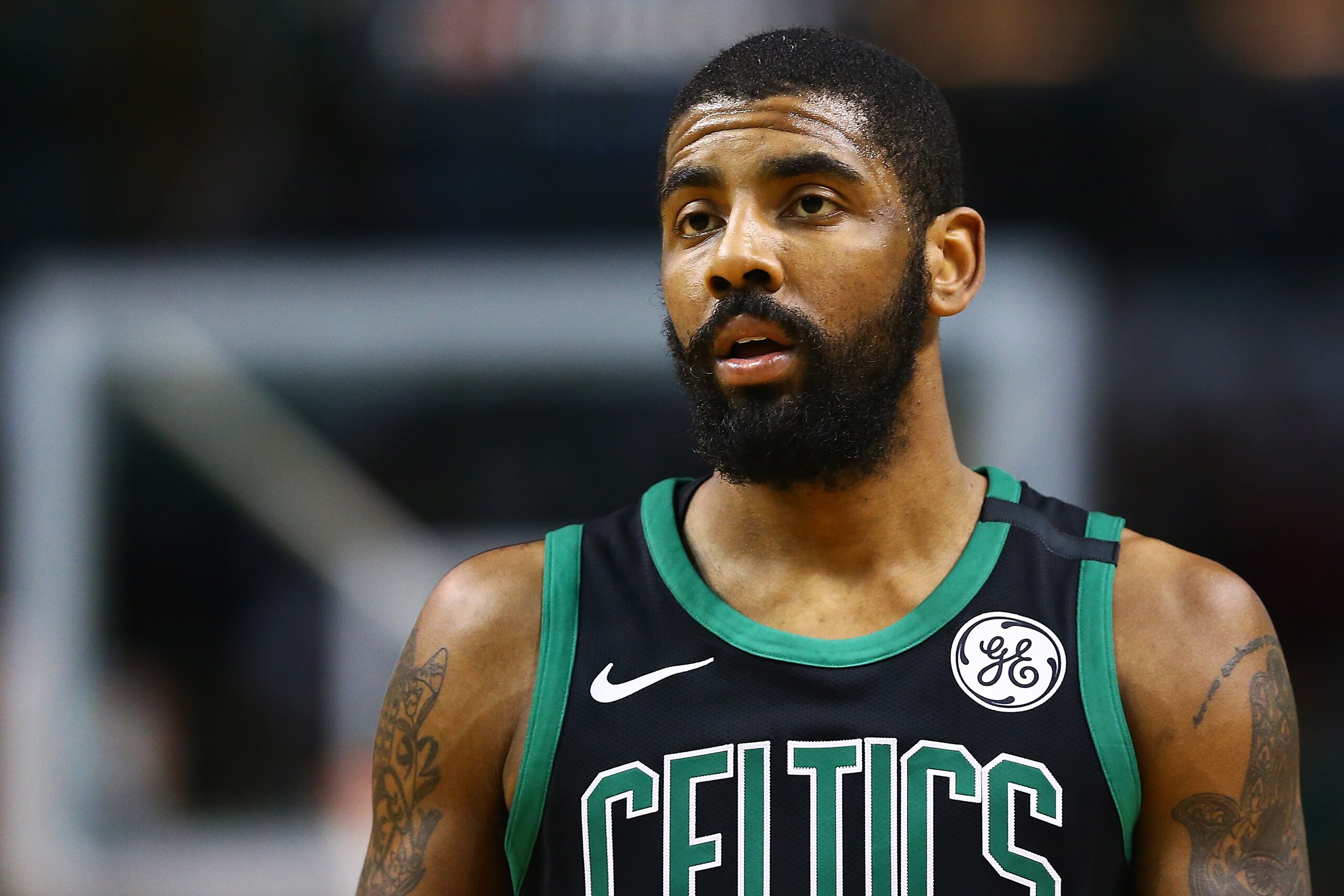 BOSTON, MA - MARCH 11: Kyrie Irving #11 of the Boston Celtics looks on during a game against the Indiana Pacers at TD Garden on March 11, 2018 in Boston, Massachusetts. NOTE TO USER: User expressly acknowledges and agrees that, by downloading and or using this photograph, User is consenting to the terms and conditions of the Getty Images License Agreement. (Photo by Adam Glanzman/Getty Images) BOSTON, MA - MARCH 11: Kyrie Irving #11 of the Boston Celtics looks on during a game against the Indiana Pacers at TD Garden on March 11, 2018 in Boston, Massachusetts. NOTE TO USER: User expressly acknowledges and agrees that, by downloading and or using this photograph, User is consenting to the terms and conditions of the Getty Images License Agreement. (Photo by Adam Glanzman/Getty Images)