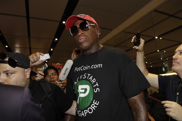 Former NBA basketball player Dennis Rodman arrives at Singapore's Changi Airport on Tuesday, June 12, 2018. (AP Photo/Wong Maye-E)