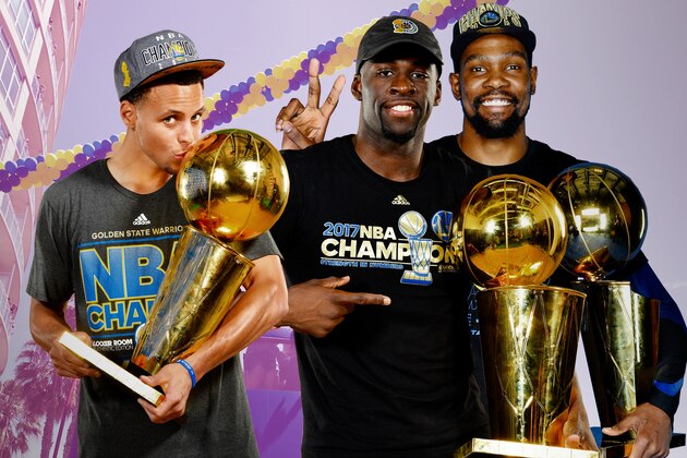CLEVELAND, OH - JUNE 8: Andre Iguodala #9, Klay Thompson #11, Stephen Curry #30, Draymond Green #23, and Kevin Durant #35 of the Golden State Warriors pose with the Larry O'Brien Championship Trophy after Game Four of the 2018 NBA Finals against the Cleveland Cavaliers on June 8, 2018 at Quicken Loans Arena in Cleveland, Ohio. NOTE TO USER: User expressly acknowledges and agrees that, by downloading and/or using this photograph, user is consenting to the terms and conditions of the Getty Images License Agreement. Mandatory Copyright Notice: Copyright 2018 NBAE (Photo by Nathaniel S. Butler/NBAE via Getty Images)