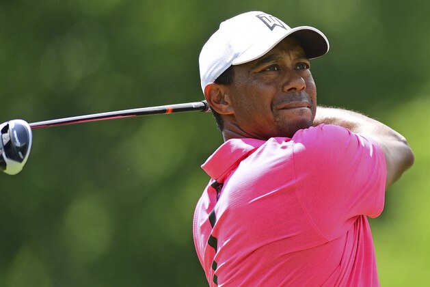 Tiger Woods follows his tee shot on the 18th hole during the third round of the Memorial golf tournament Saturday, June 2, 2018, in Dublin, Ohio. (AP Photo/David Dermer)