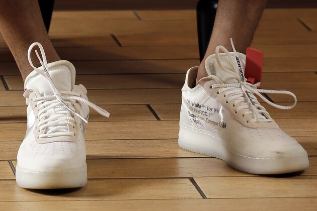 Houston Rockets' P.J. Tucker poses in a button-down Balenciaga shirt, white Alexander McQueen trousers and Off-White X Nike Air Force 1 shoes Tuesday, May 15, 2018, in Houston. Tucker's playing style and defensive grit helped the Rockets to the Western Conference finals. Off the court Tucker has spent years personally curating a wardrobe that has helped his style ascend to the upper echelons of fashion. (AP Photo/David J. Phillip)