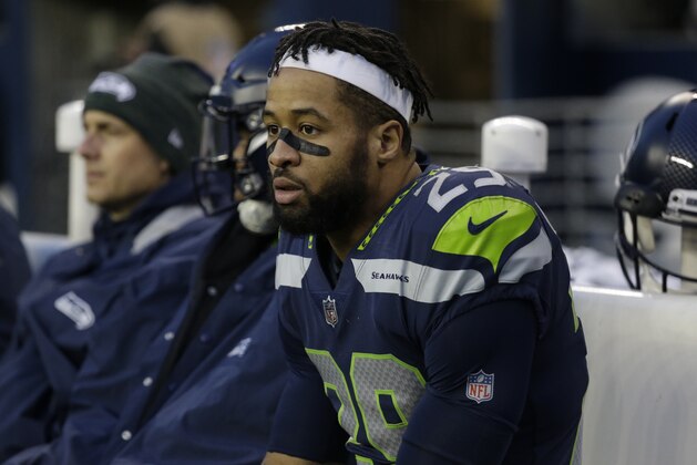 Seattle Seahawks free safety Earl Thomas sits on the bench in the second half of an NFL football game against the Los Angeles Rams, Sunday, Dec. 17, 2017, in Seattle. (AP Photo/Elaine Thompson)