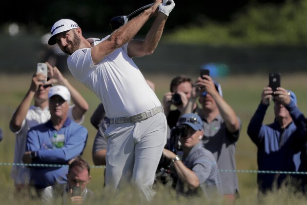 Dustin Johnson hits off the eighth tee during a practice round for the U.S. Open Golf Championship, Tuesday, June 12, 2018, in Southampton, N.Y. (AP Photo/Julie Jacobson)