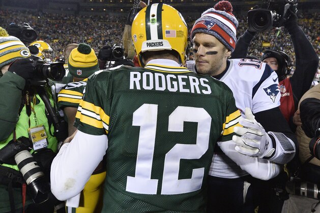 GREEN BAY, WI - NOVEMBER 30:  Tom Brady #12 of the New England Patriots (R) congratulates fellow quarterback Aaron Rodgers #12 of the Green Bay Packers after their game at Lambeau Field on November 30, 2014 in Green Bay, Wisconsin.  The Packers defeated the Patriots 26-21. (Photo by Brian D. Kersey/Getty Images)