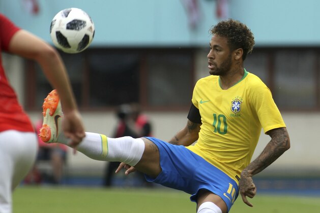Brazil's Neymar kicks the ball during a friendly soccer match between Austria and Brazil at the Ernst Happel Stadium in Vienna, Austria, Sunday, June 10, 2018. (AP Photo/Ronald Zak)