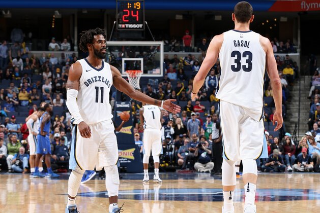 MEMPHIS, TN - OCTOBER 26:  Marc Gasol #33 and Mike Conley #11 of the Memphis Grizzlies high five during the game against the Dallas Mavericks on October 26, 2017 at FedExForum in Memphis, Tennessee. NOTE TO USER: User expressly acknowledges and agrees that, by downloading and or using this photograph, User is consenting to the terms and conditions of the Getty Images License Agreement. Mandatory Copyright Notice: Copyright 2017 NBAE (Photo by Joe Murphy/NBAE via Getty Images)