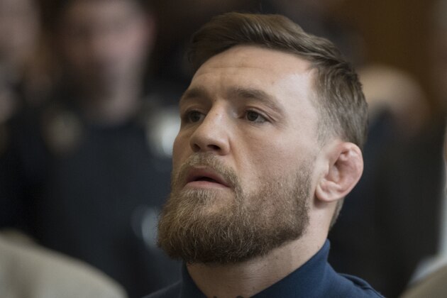 Irish Mixed Martial Arts fighter Conor McGregor looks on during his arraignment at the Kings County (Brooklyn) Criminal Court on April 6, 2018 in New York.
McGregor was charged with assault and criminal mischief by New York police on April 6, 2018 and was due to appear in court. The 29-year-old superstar reportedly surrendered at a Brooklyn police station late Thursday after allegedly attacking a shuttle bus loaded with fellow mixed martial arts fighters attending a New York media event at the Barclays Center stadium.Video footage showed McGregor hurling a dolly through a side window of the bus as it moved slowly in a parking lot at the stadium in Brooklyn.
 / AFP PHOTO / POOL / Mary Altaffer        (Photo credit should read MARY ALTAFFER/AFP/Getty Images)