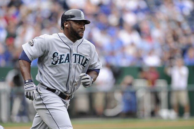 KANSAS CITY, MO - APRIL 17:  Milton Bradley #15 of the Seattle Mariners runs to first base after hitting the ball in the game against the Kansas City Royals  on April 17, 2011 at Kauffman Stadium in Kansas City, Missouri. The Seattle Mariners defeated the Royals 3-2.  (Photo by John Williamson/MLB Photos via Getty Images)
