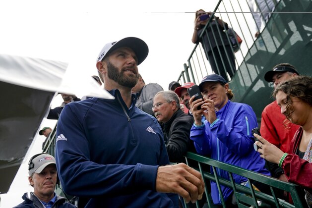 Dustin Johnson heads for the 14th tee during a practice round for the U.S. Open Golf Championship, Wednesday, June 13, 2018, in Southampton, N.Y. (AP Photo/Carolyn Kaster)