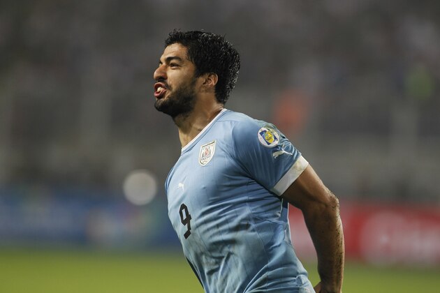 FILE - In this Sept. 6, 2013, file photo, Uruguay's Luis Suarez celebrates his goal against Peru at a 2014 World Cup qualifying soccer game in Lima, Peru. Uruguay has won the World Cup twice _ in 1930 and 1950 _ and is always a dangerous rival with a tough-nosed style of play and two of the world's top forwards in Luis Suarez and Edinson Cavani. (AP Photo/Martin Mejia, File)