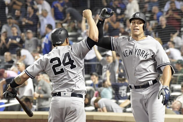 New York Yankees' Aaron Judge, right, celebrates his home run with teammate Gary Sanchez (24) during the eighth inning of a baseball game against the New York Mets Saturday, June 9, 2018, in New York. (AP Photo/Bill Kostroun)