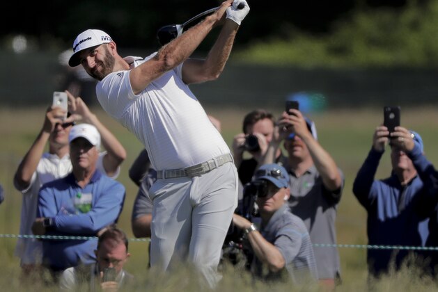 Dustin Johnson hits off the eighth tee during a practice round for the U.S. Open Golf Championship, Tuesday, June 12, 2018, in Southampton, N.Y. (AP Photo/Julie Jacobson)