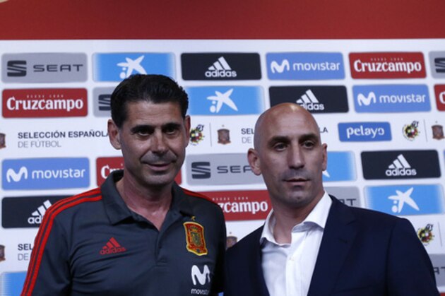 Spanish football president Luis Rubiales, right, poses with Spain's new coach Fernando Hierro before a press conference at the 2018 soccer World Cup in Krasnodar, Russia, Wednesday, June 13, 2018. Spanish soccer federation president Luis Rubiales, who made the announcement on Wednesday in Krasnodar, later said Fernando Hierro would replace Lopetegui as coach for Spain's match against Portugal in Sochi on Friday. (AP Photo/Manu Fernandez)