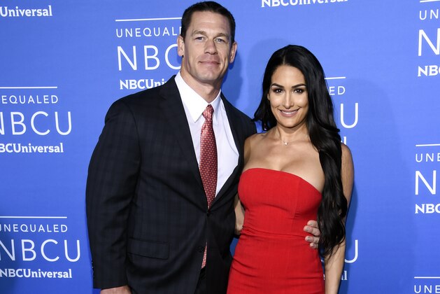 Professional wrestlers John Cena, left, and wife Nikki Bella attend the NBCUniversal Network 2017 Upfront at Radio City Music Hall on Monday, May 15, 2017, in New York. (Photo by Evan Agostini/Invision/AP)