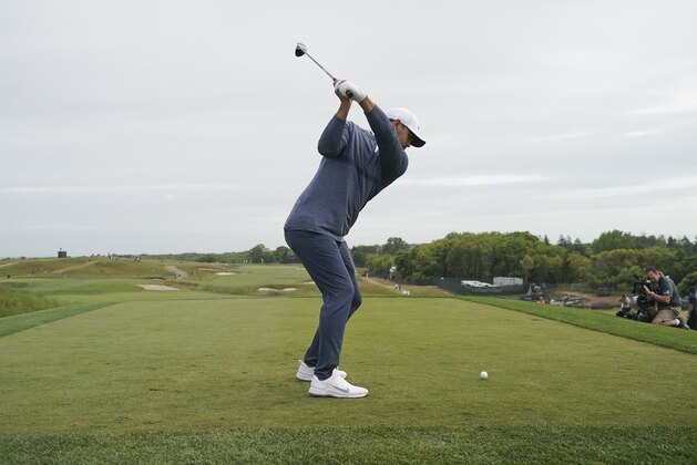 Brooks Koepka drives off the 12th tee during a practice round for the U.S. Open Golf Championship, Wednesday, June 13, 2018, in Southampton, N.Y. (AP Photo/Carolyn Kaster)
