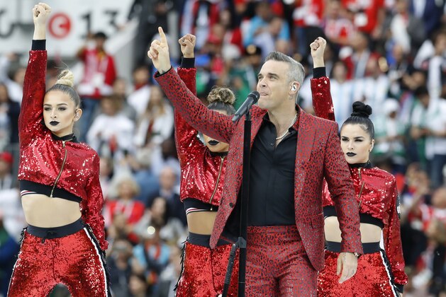British singer Robbie Williams sings at the opening ceremony of the 2018 soccer World Cup ahead of the start of the group A match between Russia and Saudi Arabia which opens the 2018 soccer World Cup at the Luzhniki stadium in Moscow, Russia, Thursday, June 14, 2018. (AP Photo/Antonio Calanni)