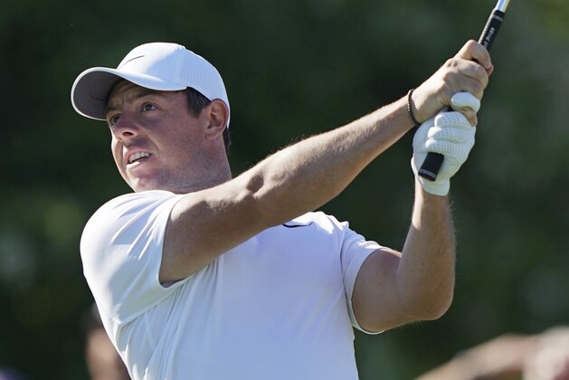Rory McIlroy of Northern Ireland plays his shot from the 11th tee during the first round of the U.S. Open Golf Championship, Thursday, June 14, 2018, in Southampton, N.Y. (AP Photo/Carolyn Kaster)