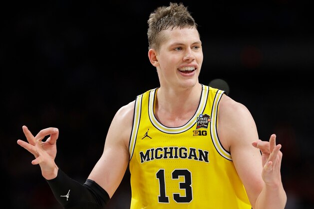 Michigan's Moritz Wagner (13) celebrates during the second half in the semifinals of the Final Four NCAA college basketball tournament against Loyola-Chicago, Saturday, March 31, 2018, in San Antonio. (AP Photo/Eric Gay)