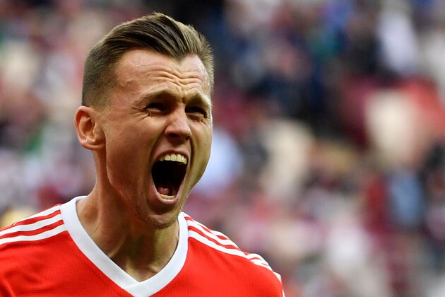 TOPSHOT - Russia's midfielder Denis Cheryshev celebrates scoring the 2-0 goal during the Russia 2018 World Cup Group A football match between Russia and Saudi Arabia at the Luzhniki Stadium in Moscow on June 14, 2018. (Photo by Alexander NEMENOV / AFP) / RESTRICTED TO EDITORIAL USE - NO MOBILE PUSH ALERTS/DOWNLOADS        (Photo credit should read ALEXANDER NEMENOV/AFP/Getty Images)