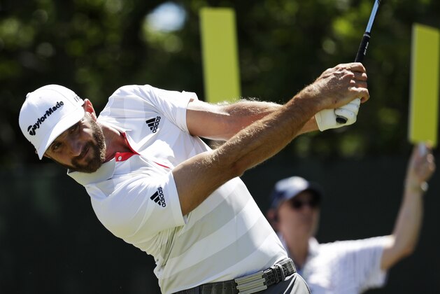 Dustin Johnson plays his shot from the second tee during the first round of the U.S. Open Golf Championship, Thursday, June 14, 2018, in Southampton, N.Y. (AP Photo/Julio Cortez)