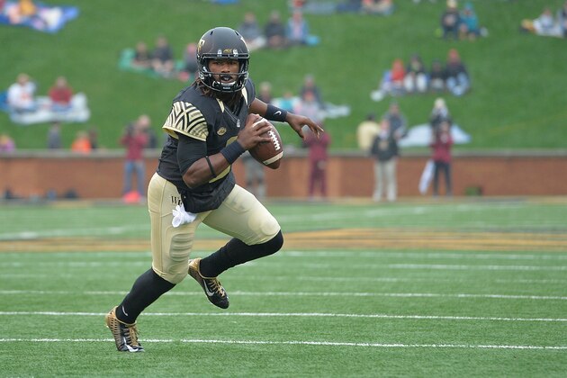 WINSTON SALEM, NC - OCTOBER 03:  Kendall Hinton #2 of the Wake Forest Demon Deacons in action against the Florida State Seminoles during their game at BB&T Field on October 3, 2015 in Winston Salem, North Carolina. Florida State won 24-16.  (Photo by Grant Halverson/Getty Images)