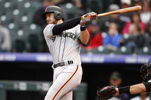 San Francisco Giants' Evan Longoria follows the flight of his double to drive in two runs off Colorado Rockies starting pitcher Chad Bettis in the first inning of a baseball game Monday, May 28, 2018, in Denver. (AP Photo/David Zalubowski)