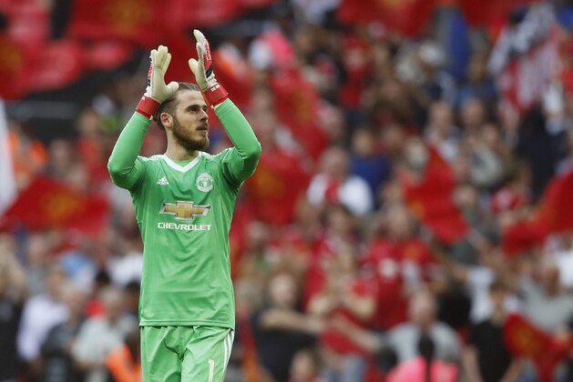 Manchester United's goalkeeper David de Gea applauds his teams fans after the end of the English FA Cup semifinal soccer match between Manchester United and Tottenham Hotspur at Wembley stadium in London, Saturday, April 21, 2018. Manchester United won the game 2-1. (AP Photo/Frank Augstein)