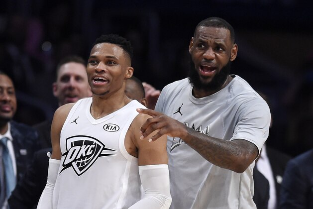 Team LeBron's Russell Westbrook, left, of the Oklahoma City Thunder, and Team LeBron's LeBron James, of the Cleveland Cavaliers, cheer from the bench during the first half of an NBA All-Star basketball game against Team , Sunday, Feb. 18, 2018, in Los Angeles. (AP Photo/Chris Pizzello)