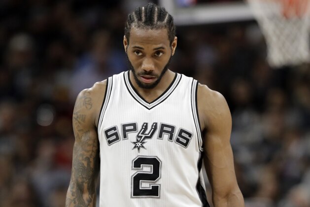 San Antonio Spurs' Kawhi Leonard (2) walks up court during the first half in Game 5 of an NBA basketball second-round playoff series against the Houston Rockets on Tuesday, May 9, 2017, in San Antonio. (AP Photo/Eric Gay)